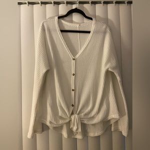 White knit long sleeve top with front tie and buttons. Size XL